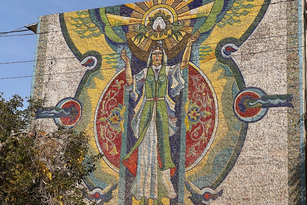 Woman with a cotton mural, Urgench